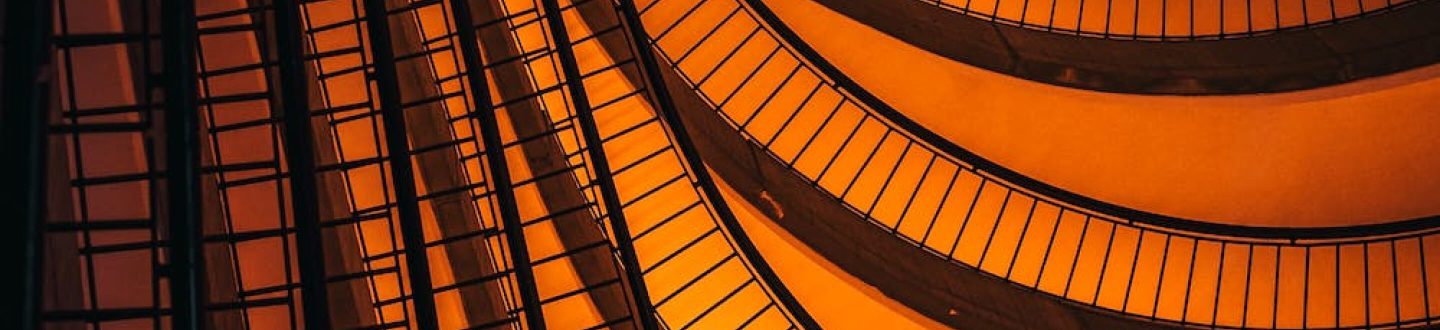 abstract of spiral staircase on an About Us page banner