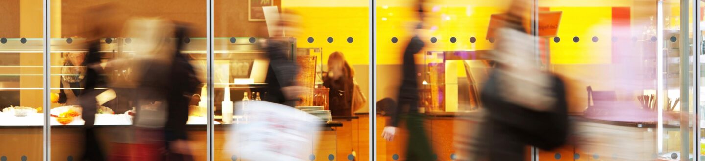 Intentional Blurred Image of People in Shopping Center - Franchising & Hospitality