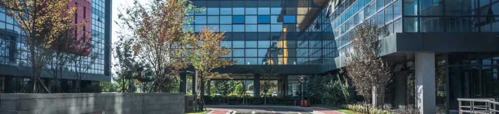 cluster of office buildings with reflective glass windows Real Estate