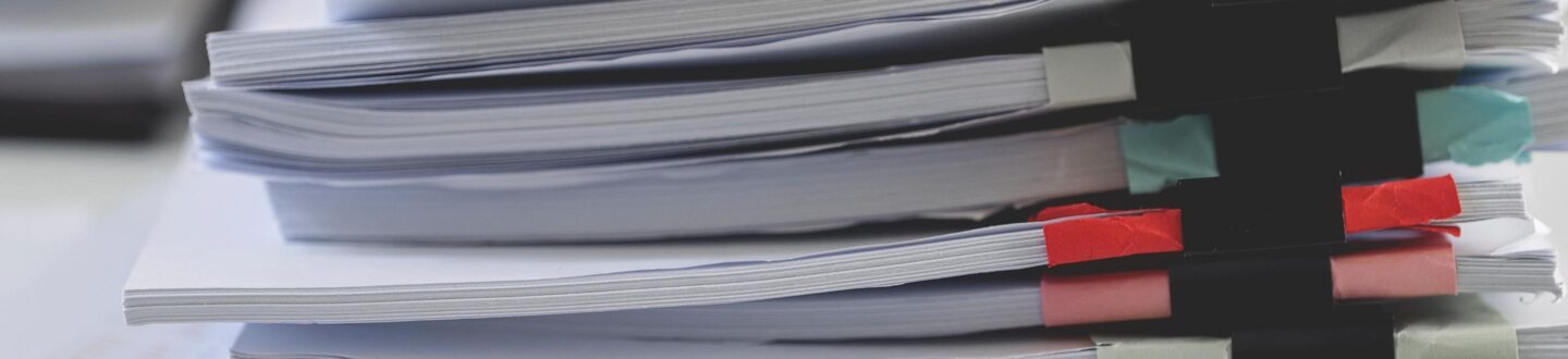 A stack of binder-clipped papers - Single Audits