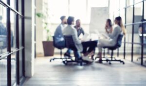 people in a meeting round a table - Careers - CTA Exceptional People