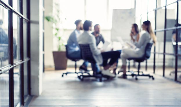 people in a meeting round a table - Careers - CTA Exceptional People