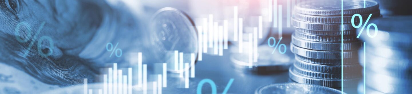 abstract image of coins, dollars, and currency symbols - Tax Structuring - Brady Ware